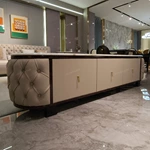 Cream Tufted Leather TV Stand with Oval Marble Top and Dark Glossy Frame